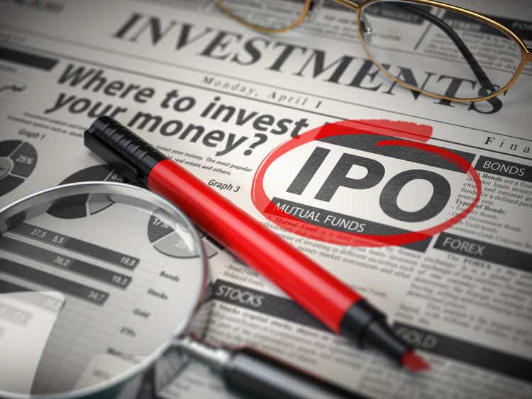 IPO Initial public offering concept. Where to Invest concept, Investments newspaper with loupe and marker.