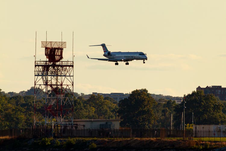 n Embraer ERJ 145 passenger airplane by American Eagle Airlines is descending to land on Ronald Reagan National Airport.