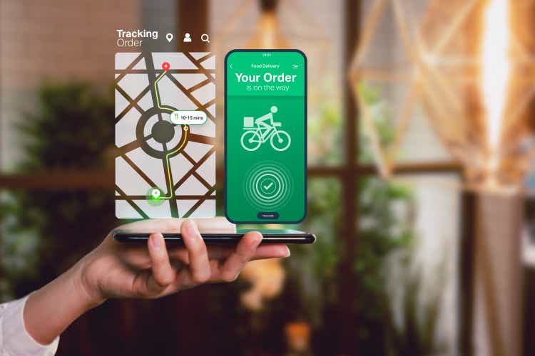 Ordering food online from home on mobile device app concept