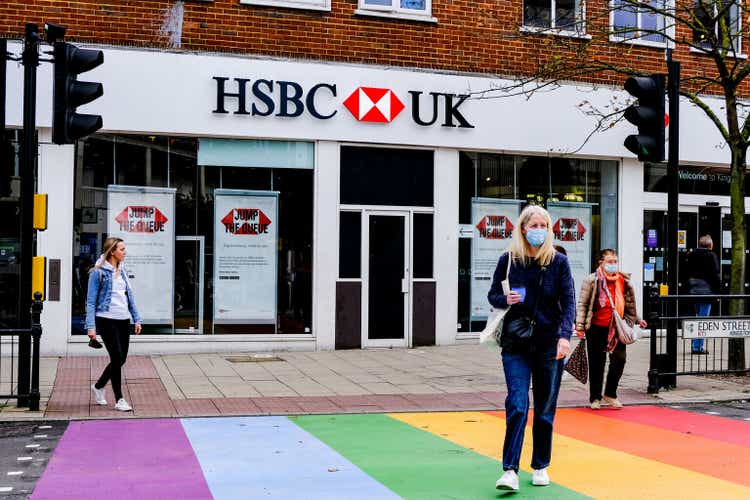 People Crossing A Rainbow Road Crossing Infront Of A Branch Of HSBC Bank During COVID-19