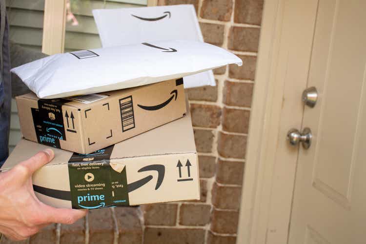 Amazon prime boxes and envelopes delivered to a front door of residential building