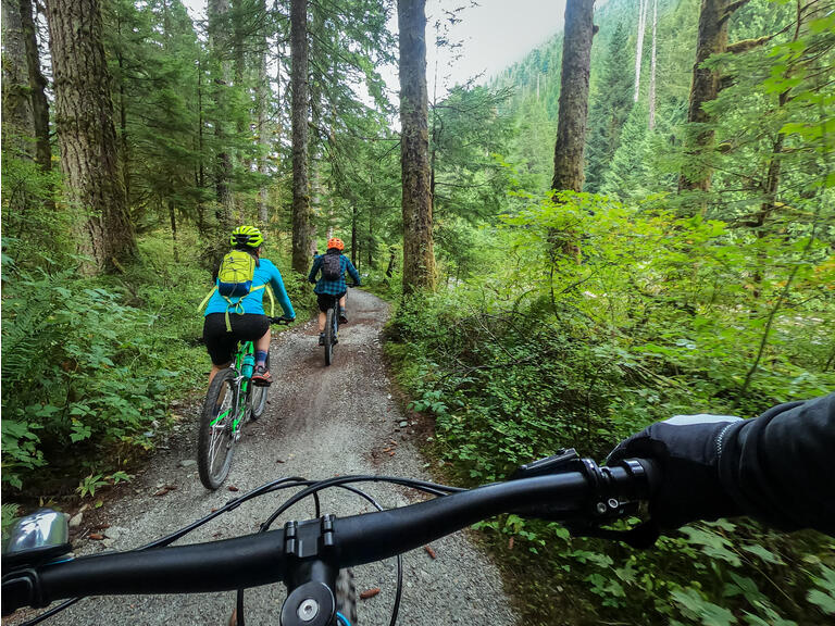 POV, Mountain Biking Family Riding on Forest Trail