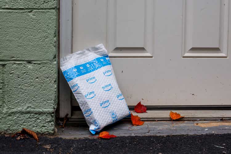 Illustrated image of an Amazon Prime package delivered outside the next door