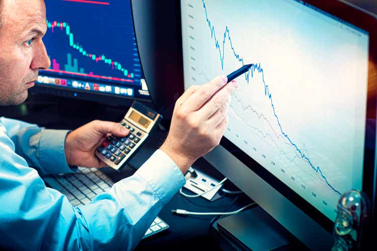 Stockbroker analyzes the financial chart