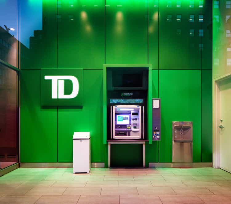 TD bank ATM green machine photographed through window