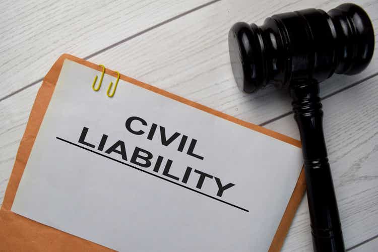 Civil Liability text with document brown envelope and gavel isolated on office desk.