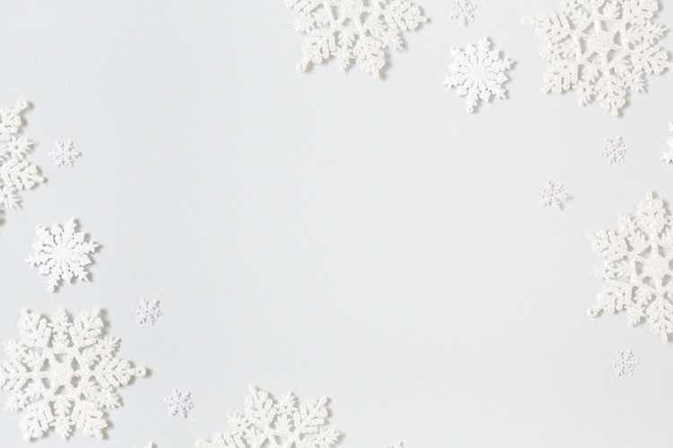 Christmas composition. Frame made of snowflakes on pastel gray background. Christmas, winter, new year concept. Flat lay, top view