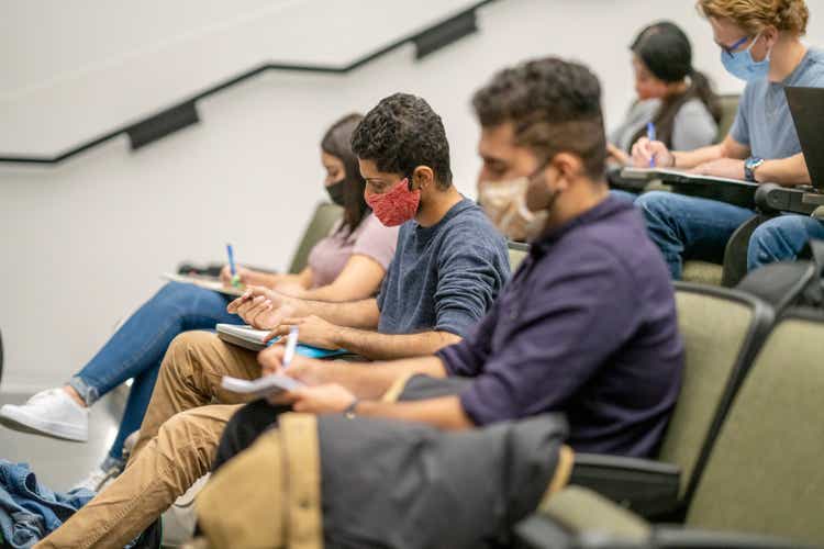 College Students wearing masks in a lecture hall