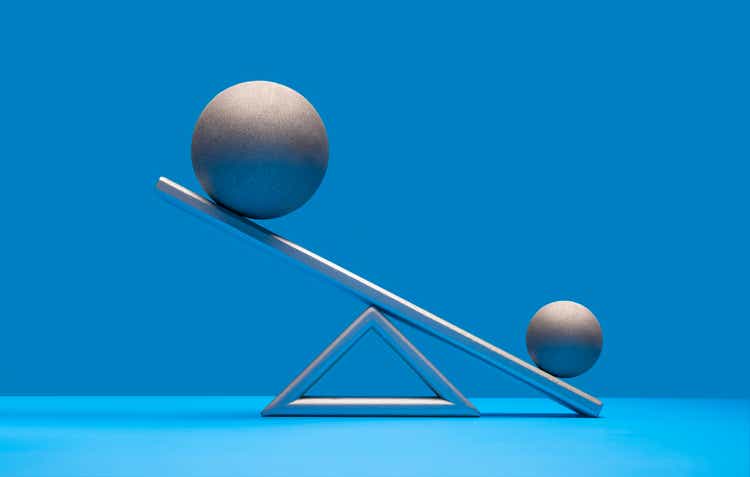 Balancing a ball on a scale