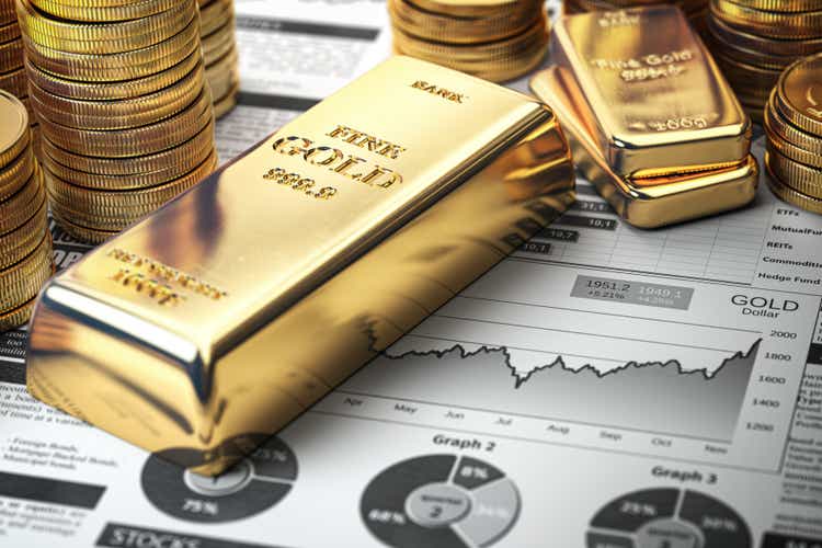 Gold bar, ingots and coins on financial report. Growth of gold on stock market concept.