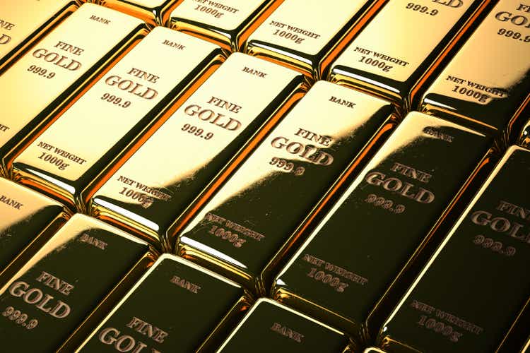 Gold bars or ingots in a row. Financial and investment concept.