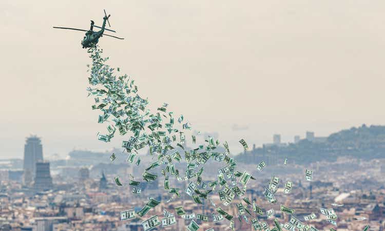 helicopter flies over a city and distributes money