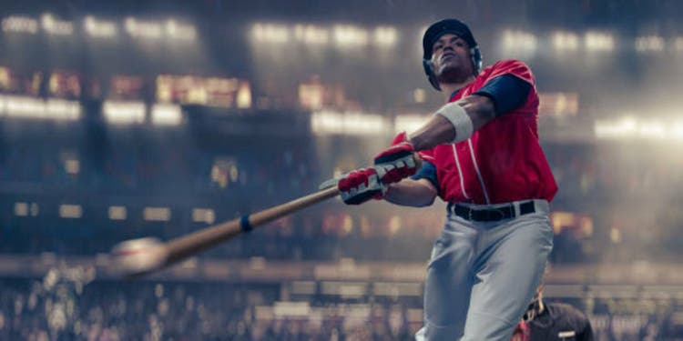 Professional Baseball Batter Hitting Baseball In Mid-Swing Close Up