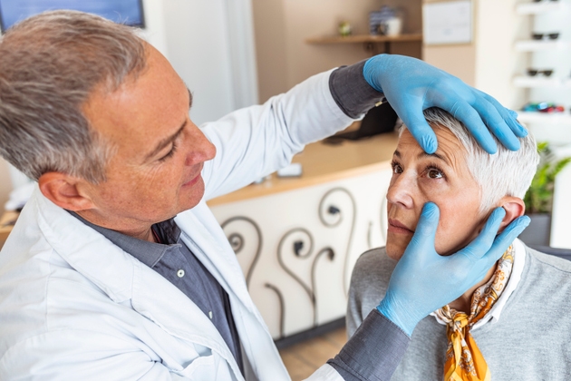 Senior woman getting eye exam