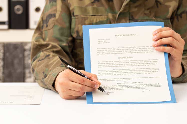 military man showing the contract to sign