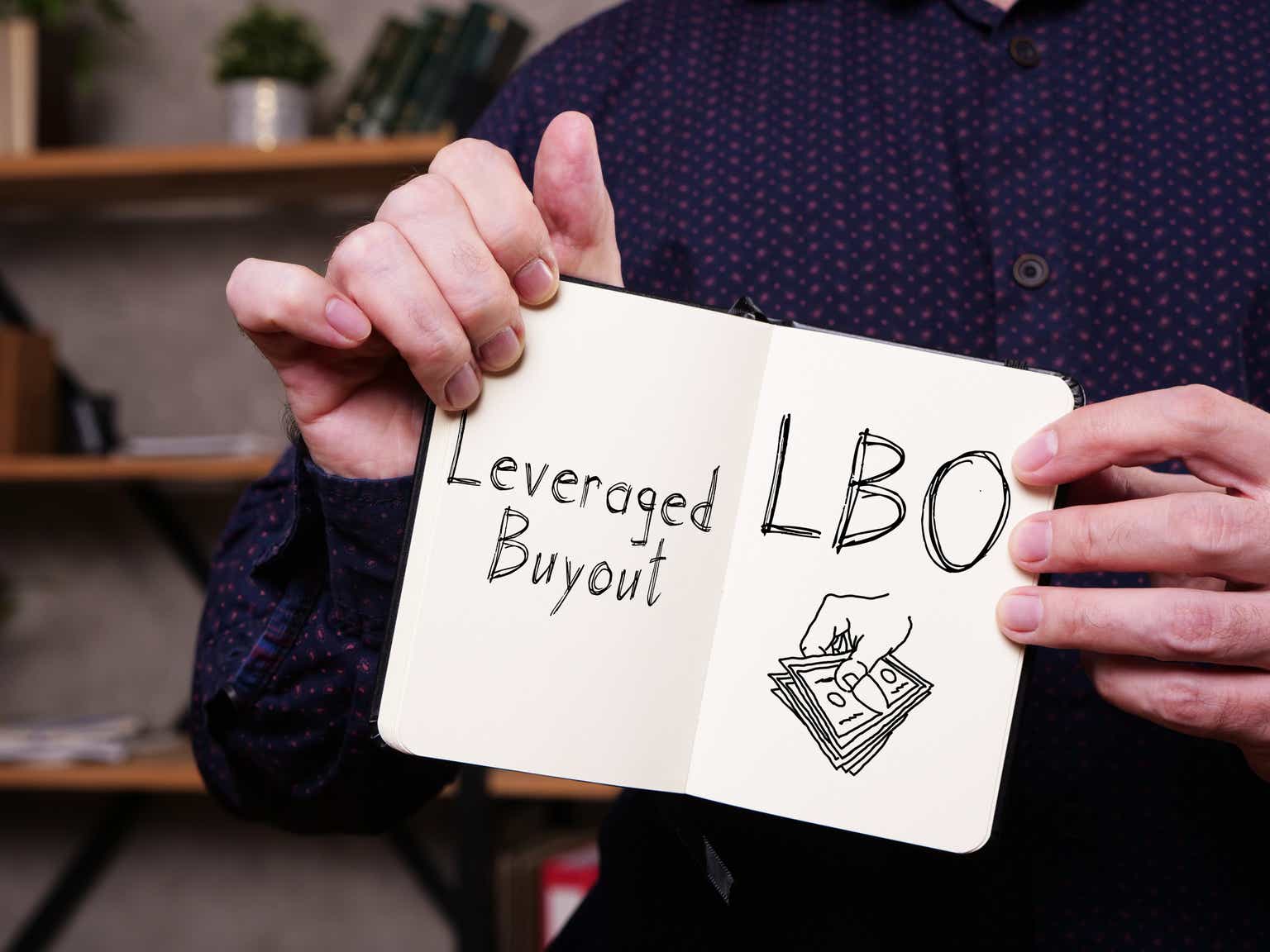Leveraged Buyout LBO is shown on the business photo using the text
