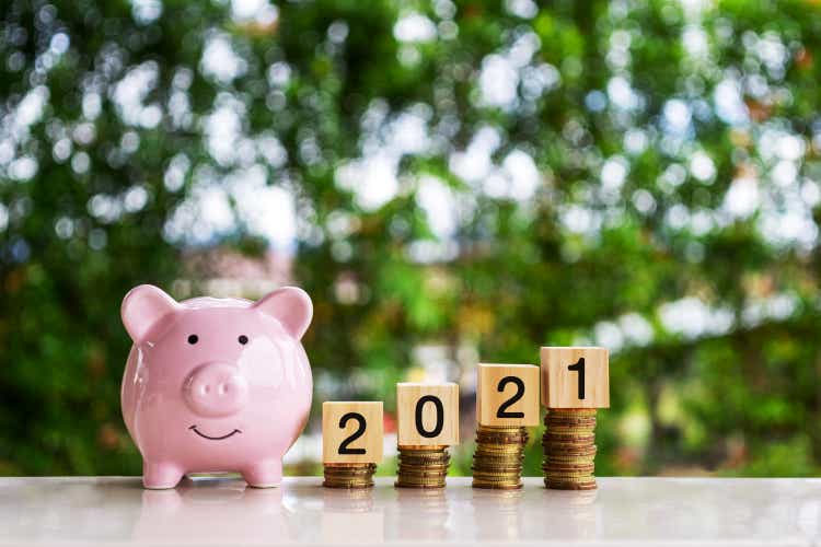 Piggy Bank, Stack of Coins and New Year 2021