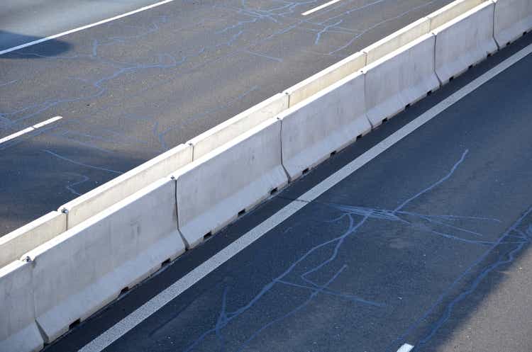 highway by means of heavy concrete barriers. they are used in places where driving directions are too close to each other. where it is not possible to use steel barriers