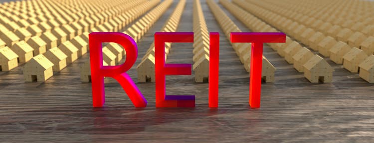 Concept image of Business Acronym REIT as Real Estate Investment Trust. 3d rendering