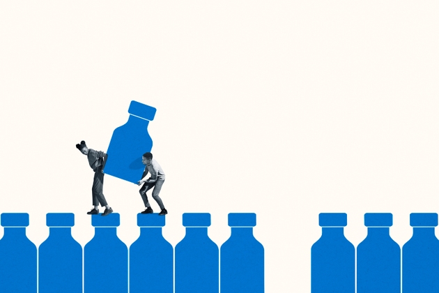 Young man and woman carrying large blue vaccine bottle