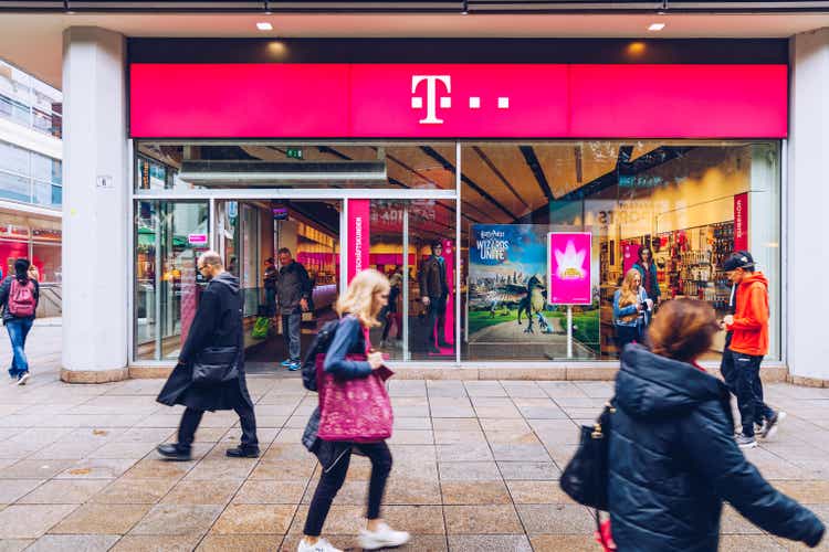 T-Mobile store with people. T-Mobile is the brand name used by the mobile communications subsidiaries of the German telecommunications company Deutsche Telekom