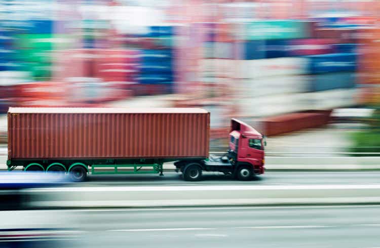 Red truck leaving the harbor