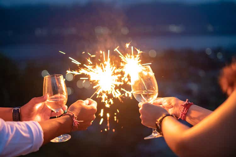 New year"s eve celebration with sparklers and wine