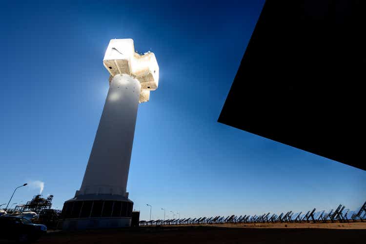 Sun rays reflect off a solar energy generation plant in South African desert