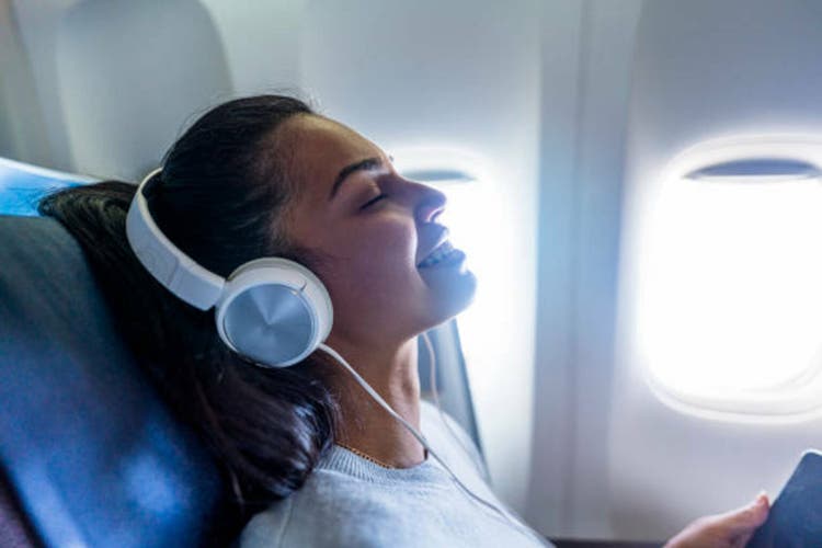 Beautiful woman travel by plane