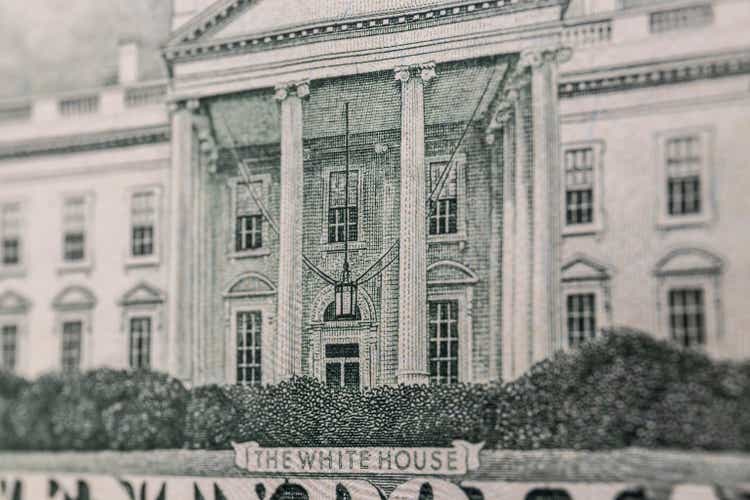 Twenty dollar bill reverse with a close-up of the White House in green ink.