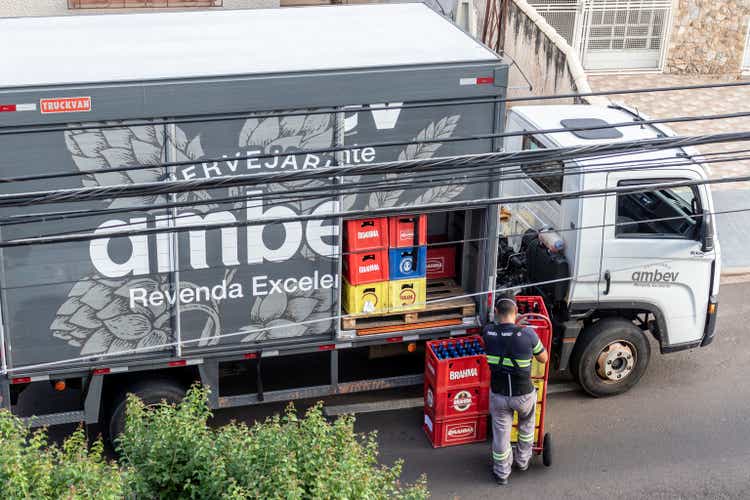 Unloading drinks from a Ambev beverage company truck on a street in downtown Marilia