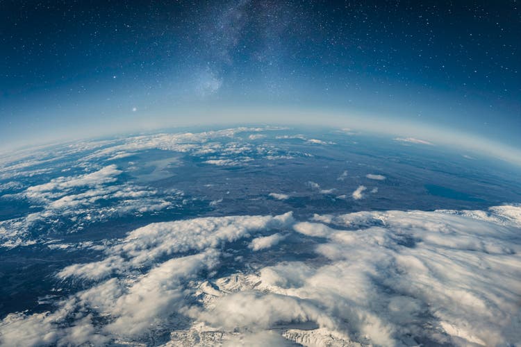 View of stars and milkyway above Earth from space