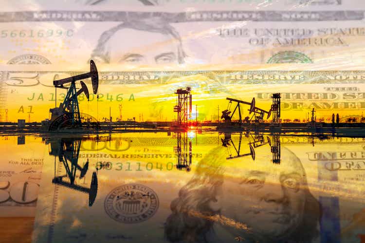 Oil pump on background of US dollar and RMB,