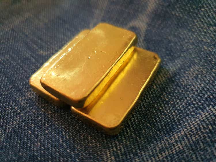 Gold bars placed on denim: used to make the background.