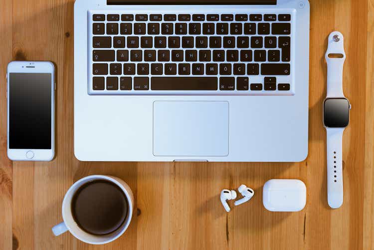 Apple brand products on a wooden table.