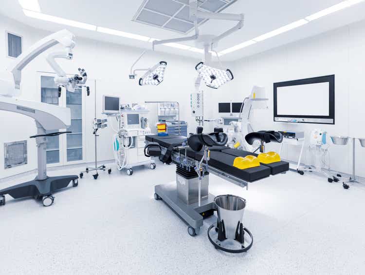 Modern hospital operating room with monitors and equipment