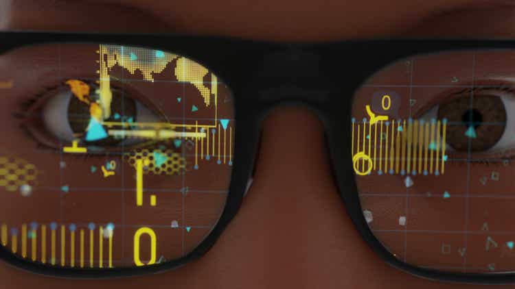 Woman wearing modern spectacles Smart glasses and reality concept with futuristic screen. Virtual technology. Close up of eye surrounded by statistics and apple analytics