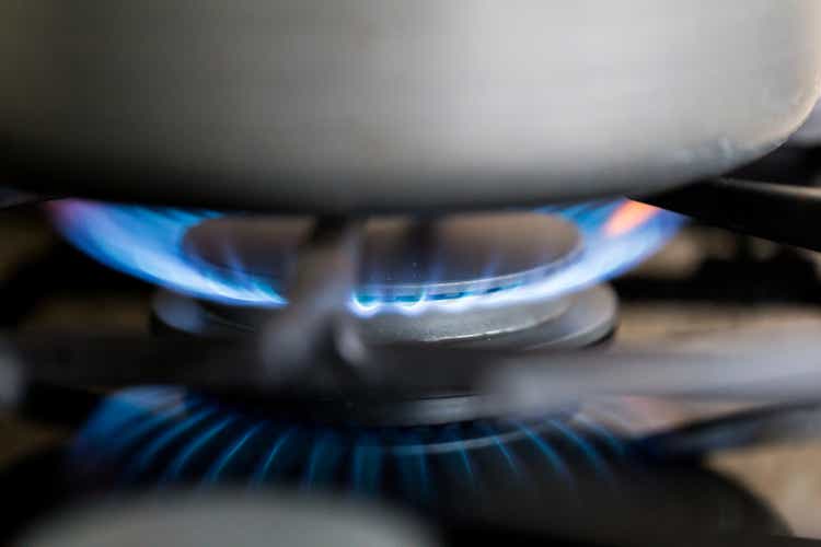 Gas hob in the kitchen with blue flames burning