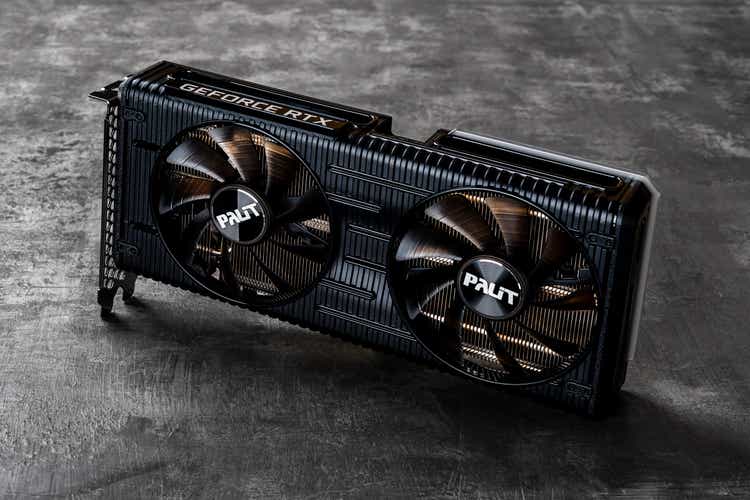 Two fans Palit Nvidia Geforce RTX 3060 Ti Dual OC gaming graphics card against dark background. Modern desktop computer hardware components for pc build and upgrade.