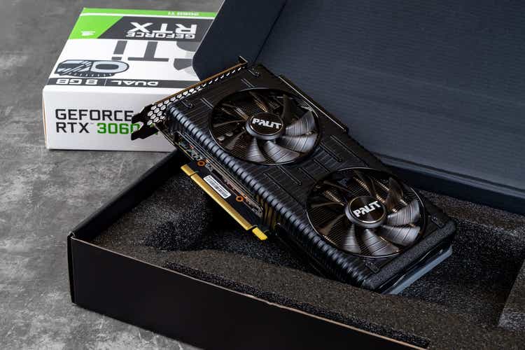 Palit Nvidia Geforce RTX 3060 Ti Dual OC gaming graphics card in an open box against dark background. Modern desktop pc hardware components for build and upgrade.