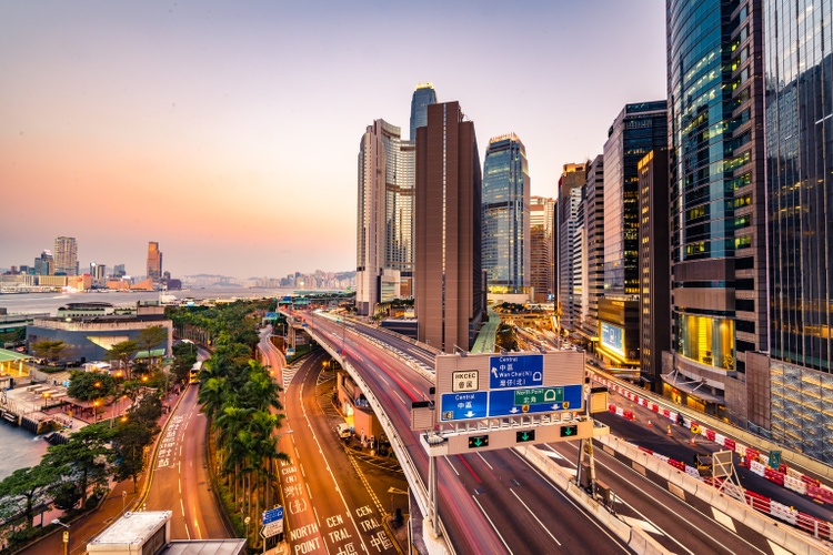 Traffic at bridge with sunset downtown in Hong Kong