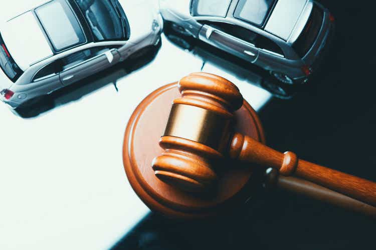Model of car and gavel. Accident lawsuit or insurance, court case.