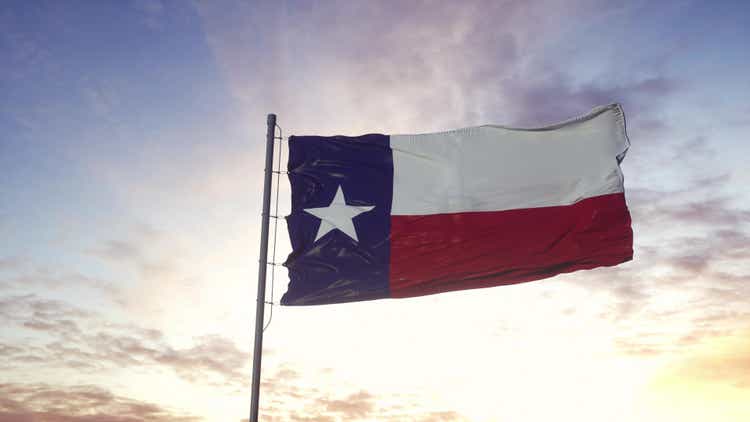 State flag of Texas waving in the wind. Dramatic sky background. 3d illustration