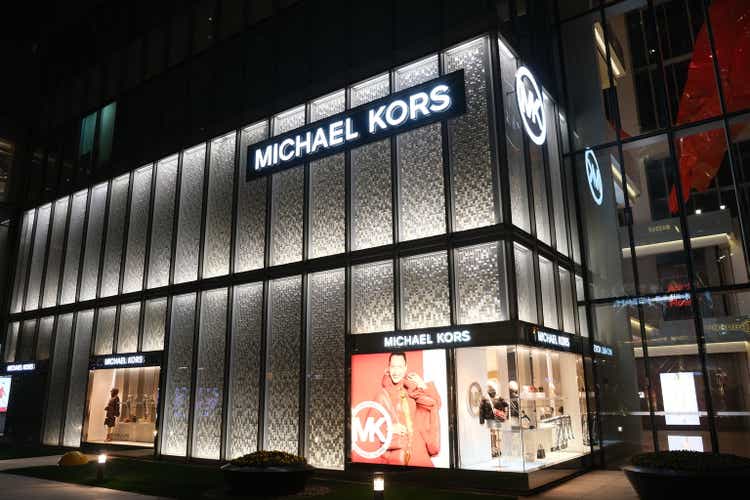 big Michael Kors store at night.