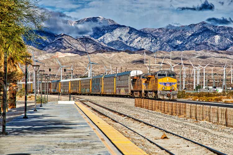 Union Pacific Freight train and Wind Turbine at Palm Springs Amtrak Station <span class=