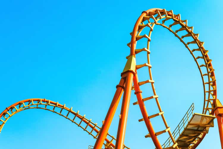 image of a rollercoaster track and the blue sky