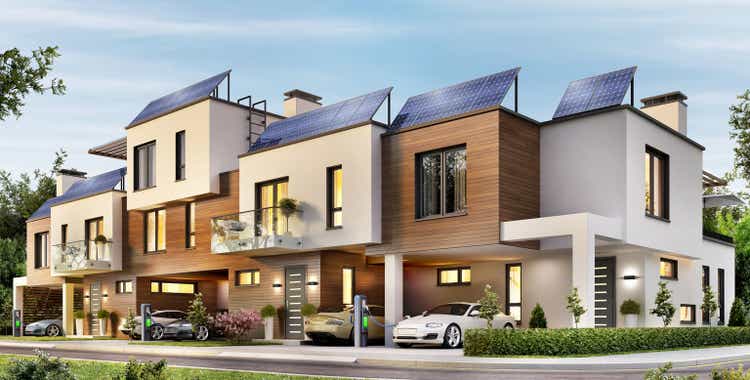 Modern house with a terrace and solar panels on the roof