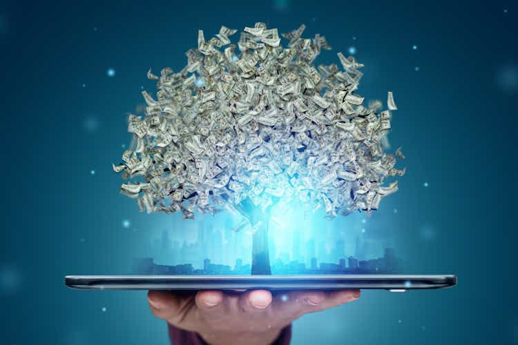 A money tree with dollars instead of leaves grows from a smartphone, work online. The concept of financial growth, passive income, dividends.