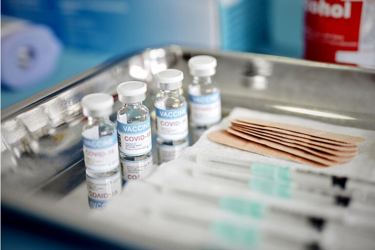 Vials With the Covid-19 Vaccine and Syringes are Displayed On a Tray at the Corona Vaccination Center