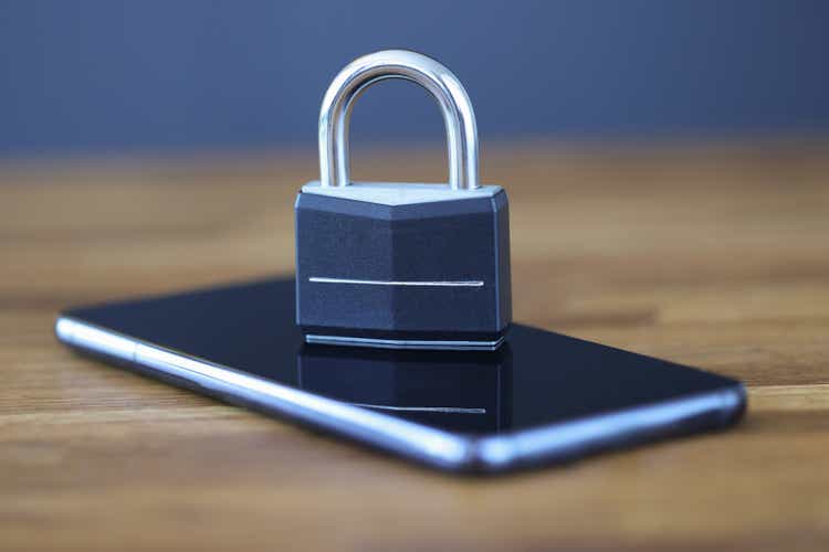 Smartphone with lock on screen is on table